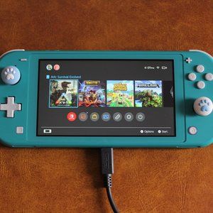 Blue Nintendo Switch Lite and 5 games